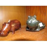 CARVED STONE FIGURINE OF HIPPO WITH CALF, TOGETHER WITH A CARVED WOODEN HIPPO