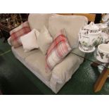 BEIGE UPHOLSTERED TWO-SEATER SOFA WITH SCATTER CUSHIONS