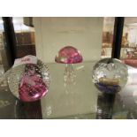 CAITHNESS 'CAULDRON RUBY' PAPERWEIGHT, IRIDESCENT GLASS MUSHROOM PAPERWEIGHT AND ONE OTHER GLASS