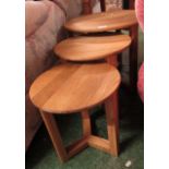 A NEST OF THREE LIGHT OAK CIRCULAR OCCASIONAL TABLES