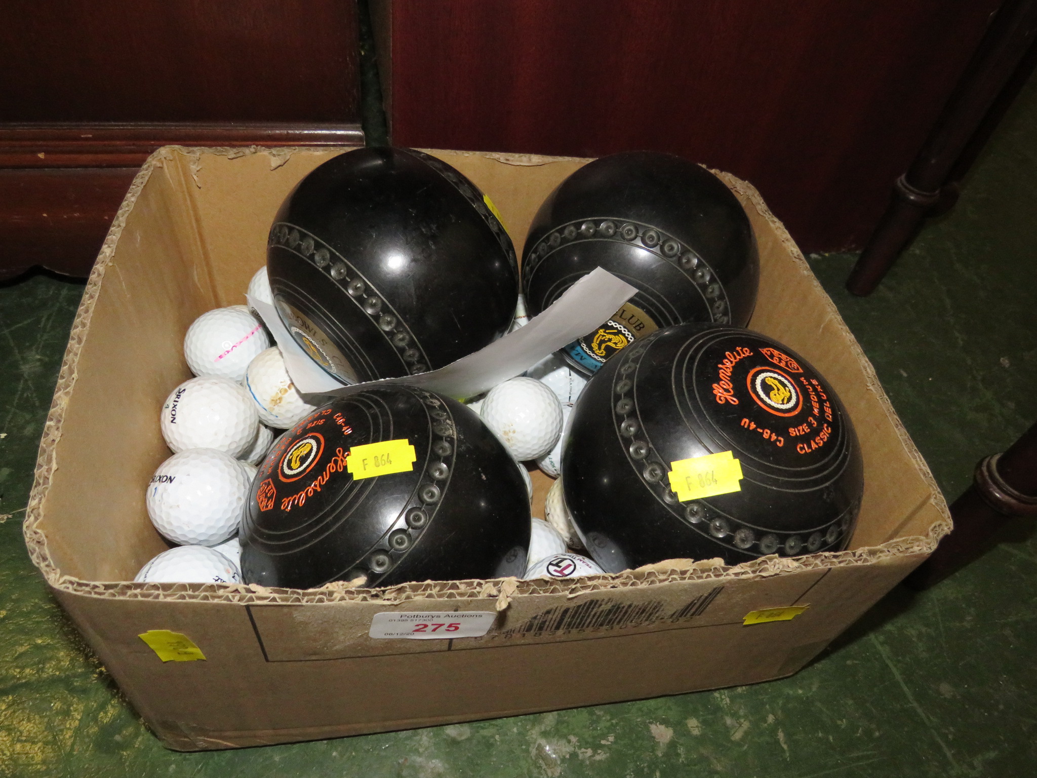 SET OF FOUR SIZE-THREE BOWLING WOODS AND GOLF BALLS