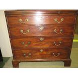 GEORGE III MAHOGANY BACHELORS CHEST OF FOUR GRADUATED DRAWERS WITH BRUSH SLIDE AND REPLACEMENT BRASS