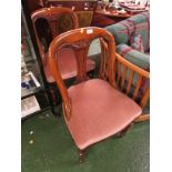 PAIR OF OAK FRAMED SIDE CHAIRS WITH CARVED CURVED BACKS AND HORSEHAIR STUFFED SEATS WITH PINK