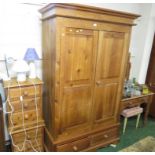 PINE TWO-DOOR WARDROBE WITH DRAWERS TO BASE, A FOUR-DRAWER DRESSING TABLE WITH MIRROR, A PAIR OF