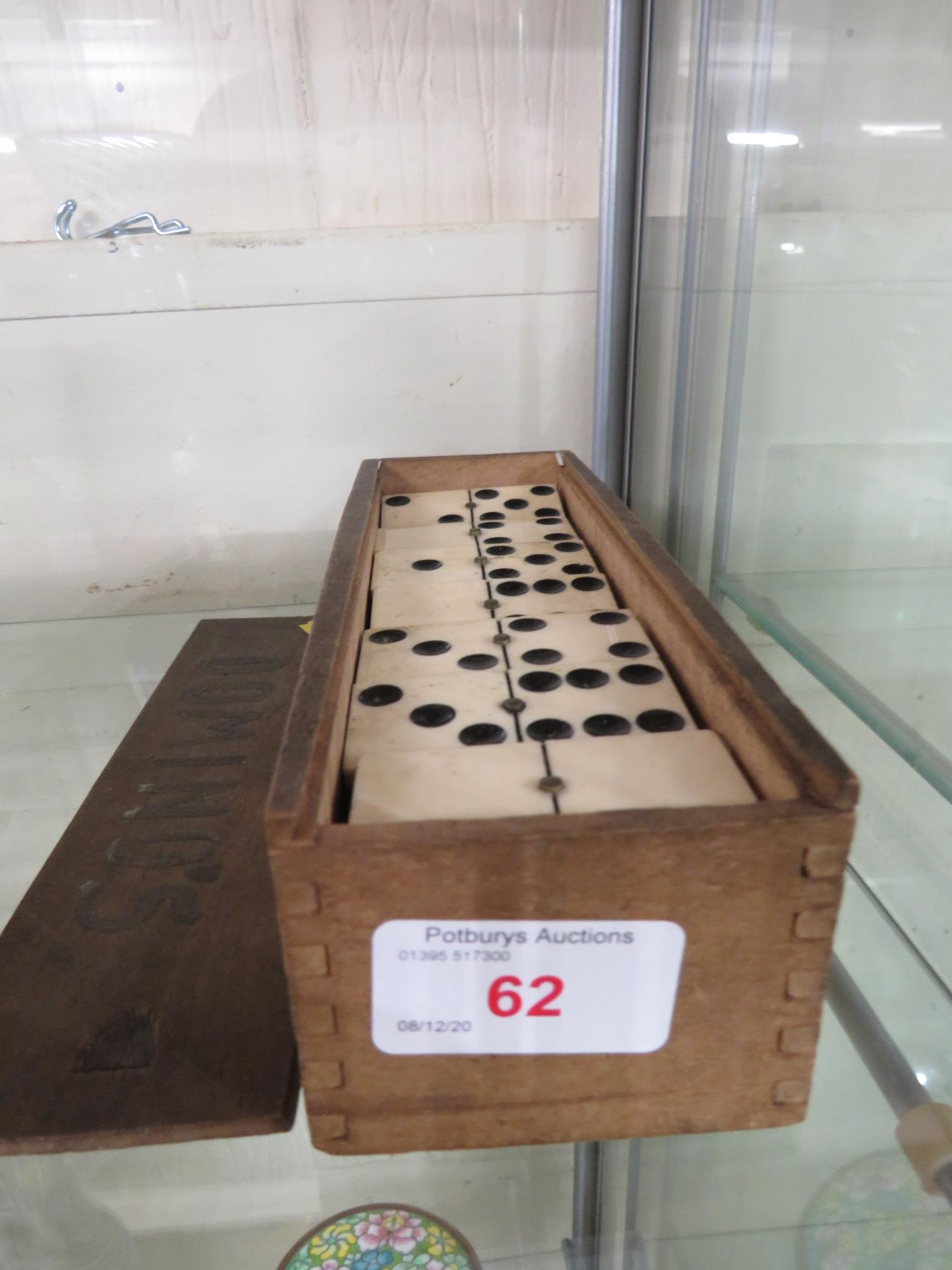 SET OF BONE AND EBONY DOMINOES IN WOODEN CASE