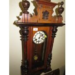 MAHOGANY CASED CHIMING WALL CLOCK WITH ENAMEL DIAL AND ROMAN CHAPTER