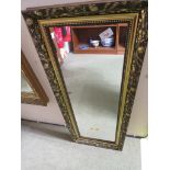 RECTANGLULAR MIRROR IN A GILT EFFECT FRAME