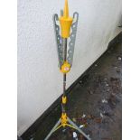 A YELLOW OUTDOOR CLOTHES HANGER WITH EXTENDABLE ARMS AND LEGS (A/F)