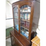 MAHOGANY GLAZED BOOKCASE, THE BASE WITH TWO DOORS AND COMPARTMENTED INTERIOR