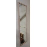 LONG RECTANGULAR WALL MIRROR IN A WOODEN FRAME