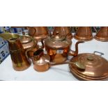 A collection of Copper items to include: kettles, bed warmers,