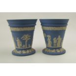 A pair of Wedgwood blue jasperware flower vases: height 12.5cm, with flower stem holder inserts (