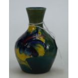 Moorcroft small vase: Moorcroft 1950s small vase decorated in the hibiscus design,height 9.5cm.