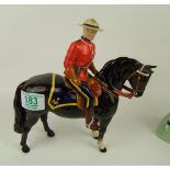 A Beswick Canadian Mountie on black horse: 1375.