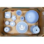 A collection of Wedgwood items to include: large fruit bowl, lamp base, vases, lidded boxes etc