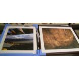 Two framed photographic prints.