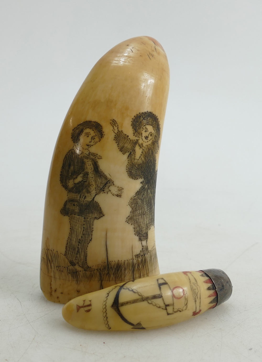 A 19th century Scrimshaw Whales Tooth: Incised with a holy bible,