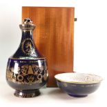 Royal Doulton commemorative items: A unusual gilded decanter made in 1965 to commemorate the 150th