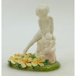 Royal Doulton figure A Saucy Nymph HN1539: In white colourway mounted on a floral base, dated 1938.