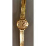 18ct gold Omega ladies Wristwatch with 18ct gold bracelet: Gross weight 27 grams.