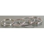 A collection of silver Bangles: Including an early arm bracelet,107.9 grams.
