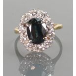 18ct yellow gold Sapphire & white stone cluster ring: Sapphire measures 10mm x 7mm,