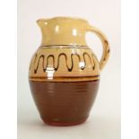 Winchcombe,Studio pottery Slip ware Jug: Impressed seal marks, height 24.5cm.