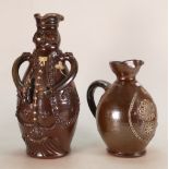 Treacle glazed Toby Decanter: Decorated with embossed floral sections.