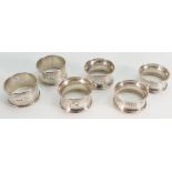 Six assorted hallmarked silver napkin / serviette rings: Weight 70.2g.