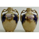 Pair of Royal Doulton gilded and hand painted two handled vases: Decorated with lakes and