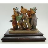 Goebel Hummel figure group Follow my Leader: A group of 7 comical children marching with a spear on