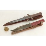 Military WWII commando knife by Cogswell & Harrison Gunmakers plus smaller knife and cap badge: