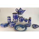 A collection of Wedgwood white on dark blue dipped Jasperware to include: A boxed limited edition