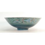Julia Carter Preston: A green ground silhouette ware bowl with incised relief foliate patter,