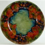 William Moorcroft Flambe plate: Decorated in the Leaf & Berry design, diameter 30cm.
