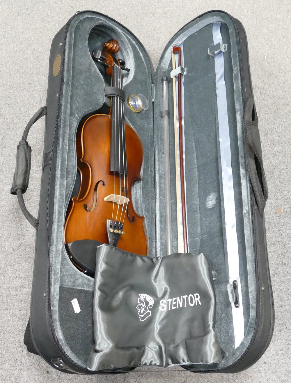 Modern Violin in case with bow: The Stentor Graduate label inside, length at back 37cm, overall 59.