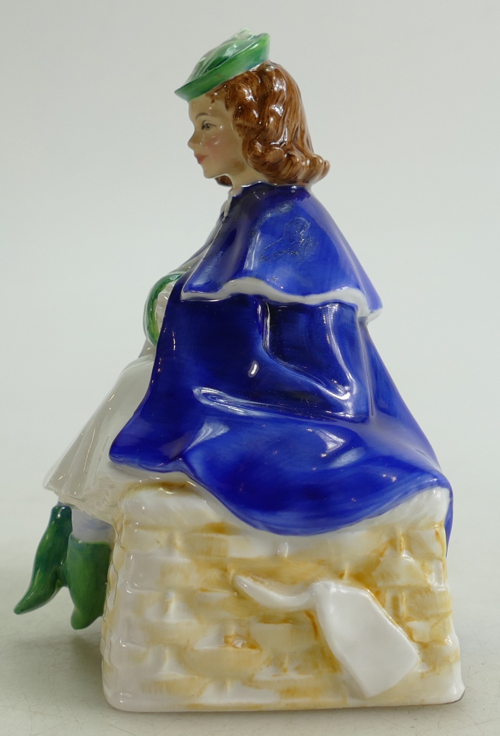 Royal Doulton prototype figure of a seated Girl on a basket with hands in muff: Figure height 14cm. - Image 4 of 4