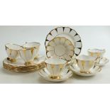 Paragon china tea set in a trial design of gold & white: Including cups & saucers etc.