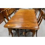 Edwardian Mahogany dining table set: Wind out table with four matching chairs & an additional leaf.
