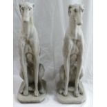 A pair of large reconstituted stone Ornaments in the form of Greyhounds: Made in England and are