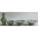 A collection of Chinese pottery in Celadon glaze: Pair of large footed dishes (one chipped),