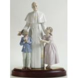 A Lladro figure of Pope John Paul II: Flanked by children, limited edition of 2500,