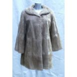 A Musk fur ladies Coat: Size 12, three quarter length.