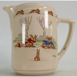 Royal Doulton Bunnykins Water Jug with Tug of War scenes: Signed by Barbara Vernon, shape number 24.
