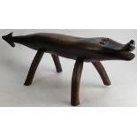 Middle Eastern carved wood Stool in the form of a Crocodile, length 83, height 28cm.