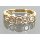 Yellow metal Diamond ring: High carat yellow metal ring set with 5 diamonds, approx 1,25ct, size P,