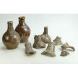 A collection of Stoneware Bellarmine Jugs: Includes an item with embossed facial decoration,