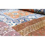 Two handmade Rugs and a Runner: Two handmade rugs together with a fine quality later runner,