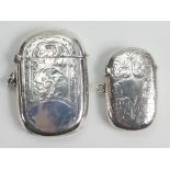 Two oval silver Vesta cases: The oversize larger one measuring 5.