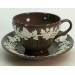 A Wedgwood Norman Wilson tea cup & saucer: Produced in a Chocolate brown Aventurine Glaze with